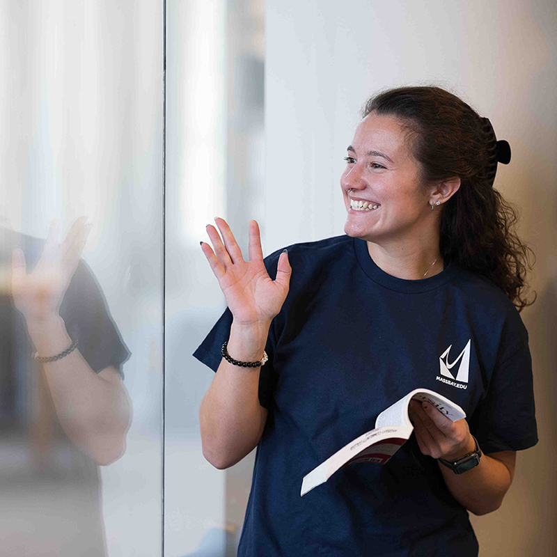 Student smiling/waving
