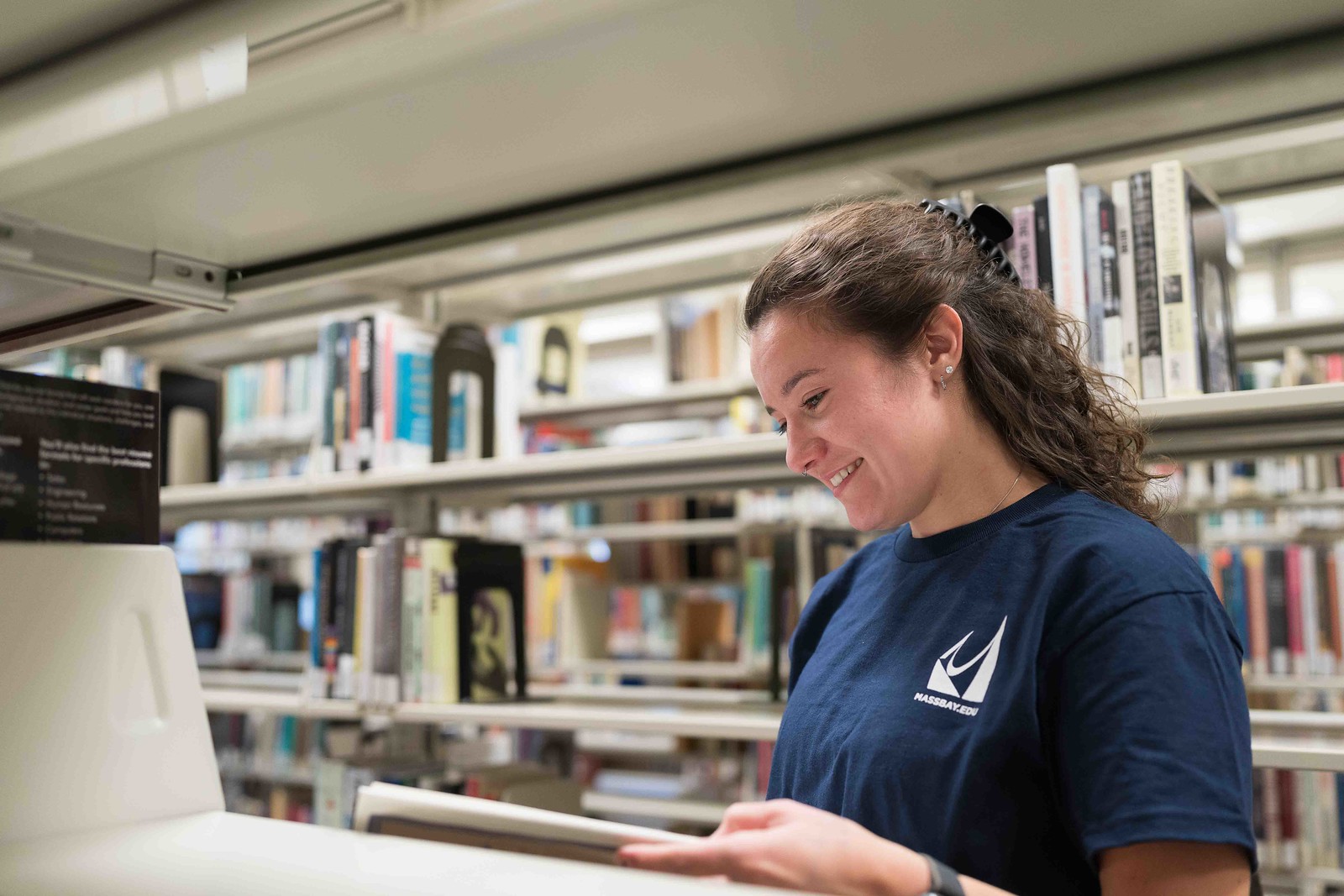 Student in Library Stacks