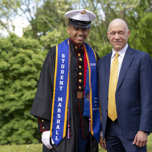 Student Marshall and President Podell at Commencement 2026