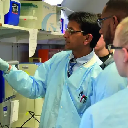 Dr. Nirmal K. Sing with students in Genomics Center