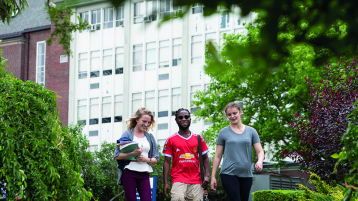 Students walking on campus - Spring