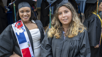 Two female graduates, MassBay Community College Class of 2026